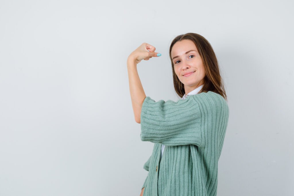 girl with a strong arm showing strong immunity 
