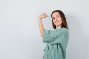 girl with a strong arm showing strong immunity 